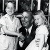 Walt Disney and the first two children at Disneyland, July 17, 1955