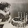 Shirley Temple and her birthday cake, April 1936