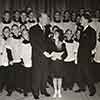 Nelson Eddy, Shirley Temple, and Bob Mitchell, leader of St. Brendan's Boys' Choir, Screen Guild Gulf Oil radio broadcast of the Blue Bird, December 24, 193