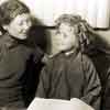 Shirley Temple in between takes of Stowaway, 1936, with Chinese language teacher Bessie Nyi