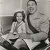 Shirley Temple and Victor McLaglen during filming of Wee Willie Winkie, 1937