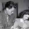 John Agar and Shirley Temple in Glendale signing their marriage license, September 17, 1945