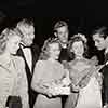 Shirley Temple 16th Birthday party with Dorothy Mann, Tom Tully, stand-in Mary Lou Isleib, Guy Madison, Shirley, and John Derek on set of I'll Be Seeing You, April 23, 1944