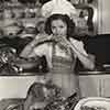 Shirley Temple at her Brentwood home cooking a Thanksgiving turkey, 1941