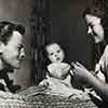 John Agar, daughter Linda Susan, and Shirley Temple at home on Rockingham Drive, 1948
