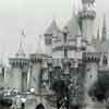 Disneyland Cast Member David M. and his mother in front of the Sleeping Beauty Castle’s bridge