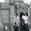 Disneyland Sleeping Beauty Castle photo with Audie Murphy and family, 1956