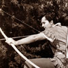 On set photo of John Derek in Rogues of Sherwood Forest, 1950