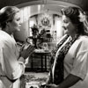 Kathleen Turner and Marianne Sägebrecht in War of the Roses, 1989