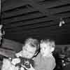 Audie Murphy and son at Disneyland Frontierland Shooting Gallery, 1956