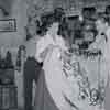 Audie Murphy and his wife at the Davy Crockett Frontier Arcade at Disneyland, 1956