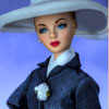 Franklin Mint Grace Kelly vinyl doll wearing Arrival In Monaco outfit