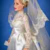 Franklin Mint Grace Kelly vinyl doll wearing Wedding Gown outfit