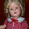 Shirley Temple 16 inch composition doll wearing Bright Eyes loop dress