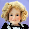 Danbury Mint Shirley Temple doll by Elke Hutchens wearing Ideal Heidi dress photo