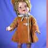 Shirley Temple doll wearing Poor Little Rich Girl coat ensemble