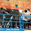 Shepard Fairey and crew painting a mural in South Park neighborhood of San Diego, July 15, 2010