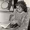 Shirley Temple at home reading, 1939