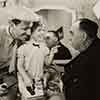 Director Henry Lachman, Shirley Temple, and Irvin Cobb, during filming of Baby Take a Bow, 1934