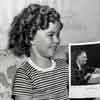 Shirley Temple in her Fox Bungalow with an autographed photo from President Franklin Roosevelt during Captain January filming, 1936