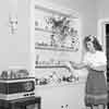 Shirley Temple at home dusting, 1943