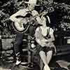 Gene Autry and Shirley Temple shooting Red Cross promo photos at her Brentwood home, Spring 1940