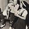 Gene Autry and Shirley Temple shooting Red Cross promo photos at her Brentwood home, Spring 1940