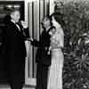 Clifton Webb, Darryl Zanuck, and Shirley Temple at Shirley's 20th Century-Fox welcome home party for "Mr. Belvedere Goes To College," November 1948