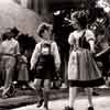 Candid of Johnny Russell and Shirley Temple filming on the set of The Blue Bird 1940