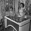 Shirley Temple at home with John Agar on the vibraphone, 1949