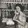 Shirley Temple at her Brentwood home reading the script for Kathleen, 1941